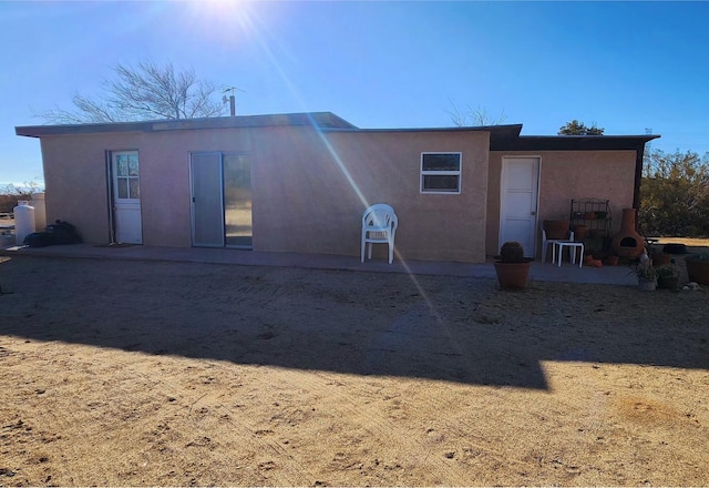 back of house with a patio