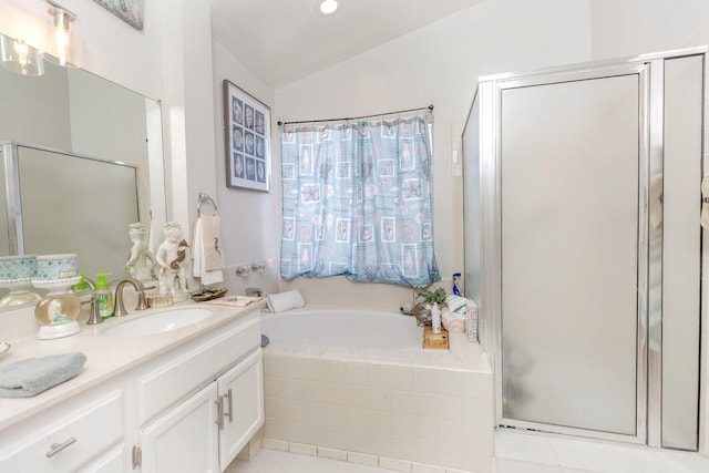 bathroom featuring shower with separate bathtub, vanity, tile patterned floors, and lofted ceiling