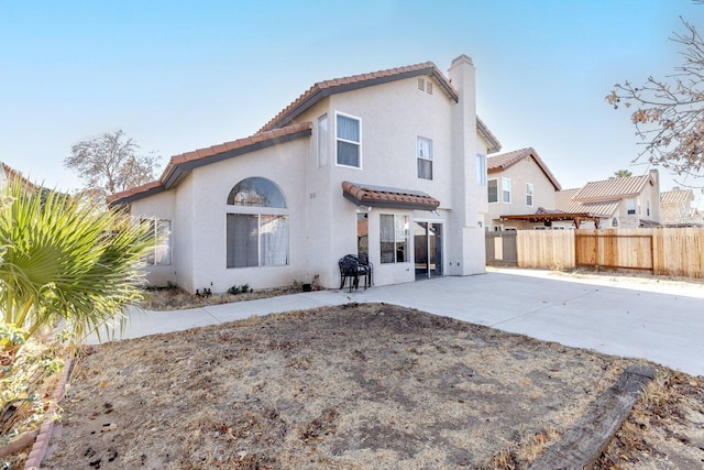 back of property with a patio area