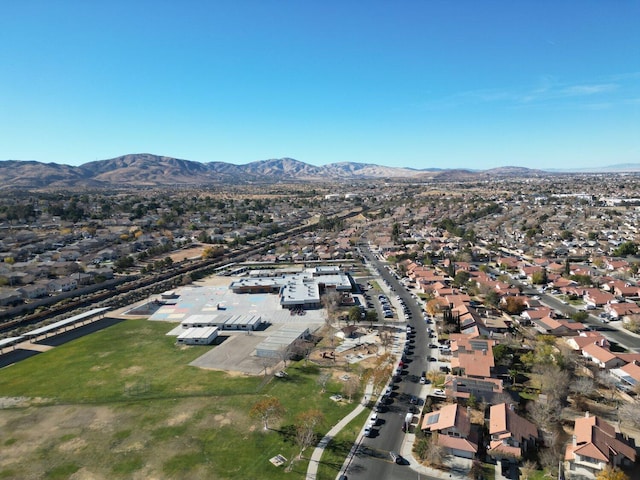 birds eye view of property with a mountain view