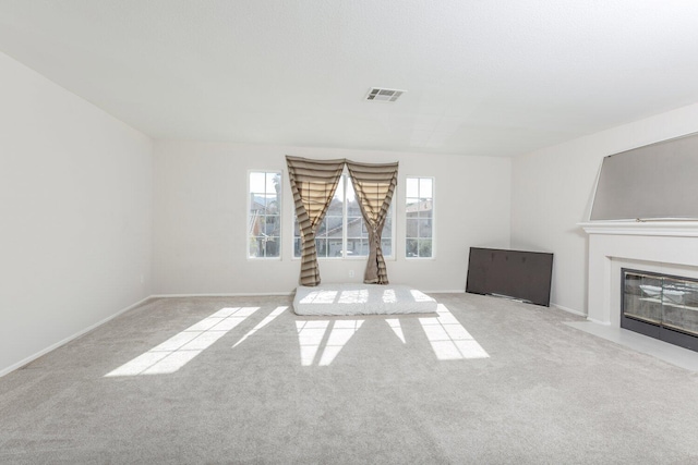 unfurnished living room with light carpet