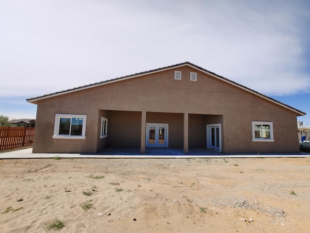 back of house featuring a patio and french doors