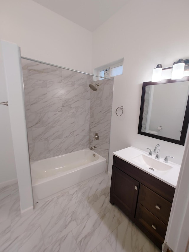 bathroom featuring vanity and tiled shower / bath combo