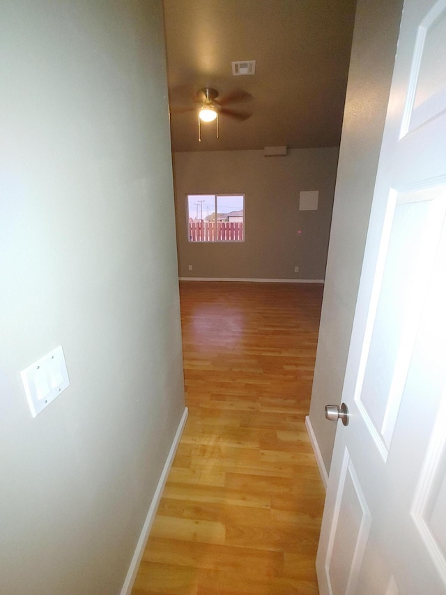 hallway with light wood-type flooring