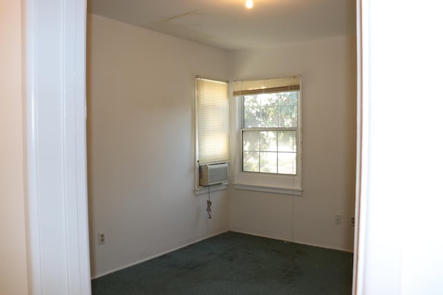 carpeted empty room with cooling unit