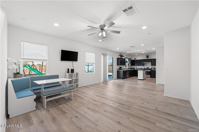 2436 Lugar Bonito Ct, Rosamond, CA 93560 - living area with ceiling fan, light wood-style flooring, and recessed lighting