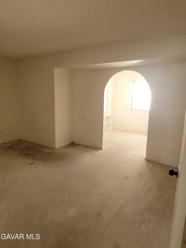 964 Roosevelt St, Ridgecrest, CA 93555 - unfurnished room featuring arched walkways and carpet flooring