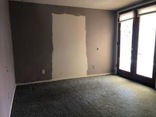 964 Roosevelt St, Ridgecrest, CA 93555 - empty room featuring healthy amount of natural light and carpet flooring