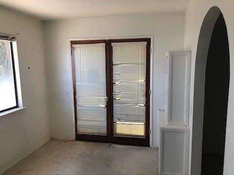964 Roosevelt St, Ridgecrest, CA 93555 - doorway to outside with arched walkways and light carpet