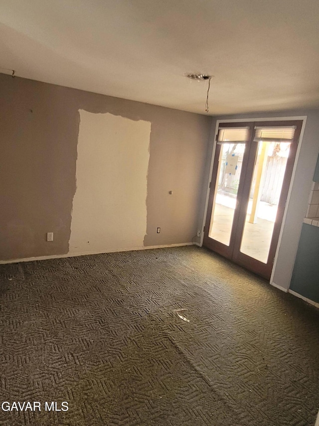 964 Roosevelt St, Ridgecrest, CA 93555 - carpeted spare room with baseboards and french doors