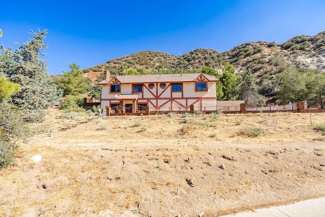 back of property featuring a mountain view