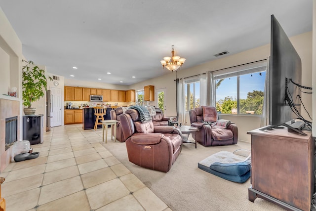 38360 Wakefield Pl, Palmdale, CA 93551 - living area featuring a chandelier, light tile patterned flooring, recessed lighting, and light colored carpet
