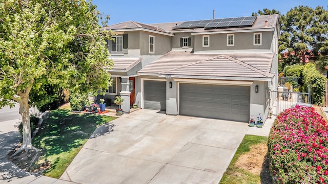 38360 Wakefield Pl, Palmdale, CA 93551 - traditional-style house featuring stucco siding, solar panels, a tiled roof, concrete driveway, and an attached garage