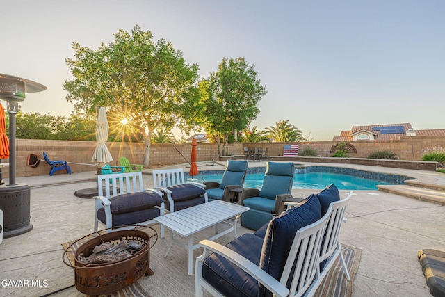 6015 Country Ln, Quartz Hill, CA 93536 - fenced backyard featuring a patio and an outdoor living space with a fire pit