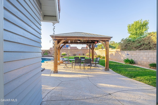 6015 Country Ln, Quartz Hill, CA 93536 - fenced backyard featuring a gazebo, outdoor dining space, and a patio area