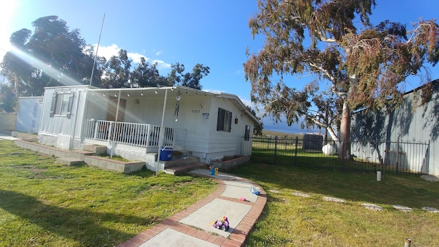 exterior space with a yard and covered porch