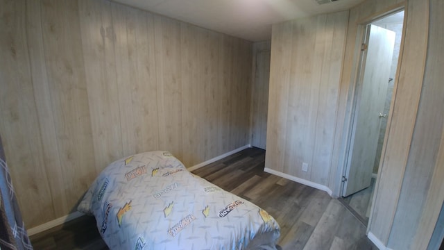 bedroom with hardwood / wood-style flooring