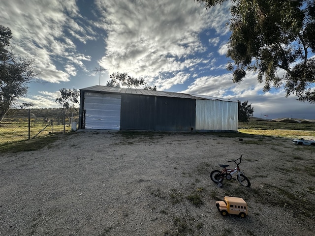 garage featuring a rural view