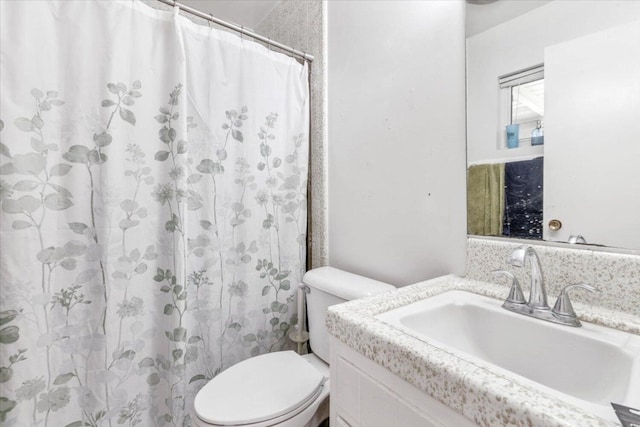 bathroom with vanity, a shower with curtain, and toilet