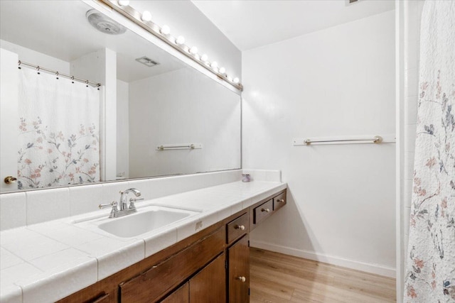 bathroom with wood-type flooring and vanity