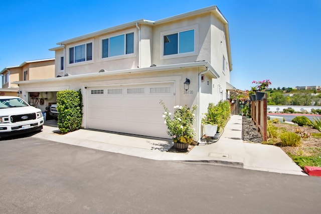 townhome / multi-family property featuring a garage