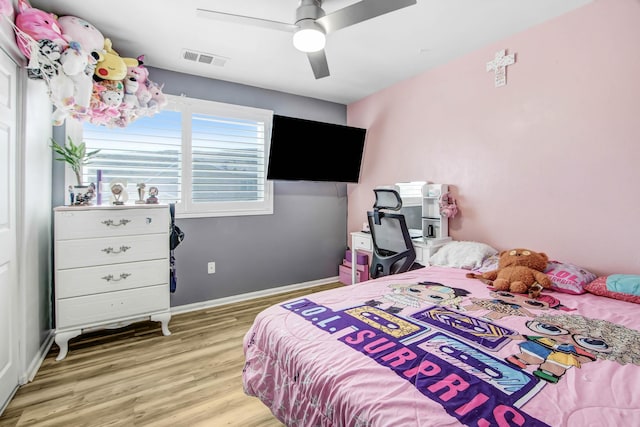 bedroom featuring ceiling fan and light hardwood / wood-style floors