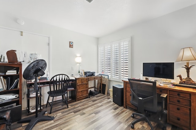 office space with light wood finished floors