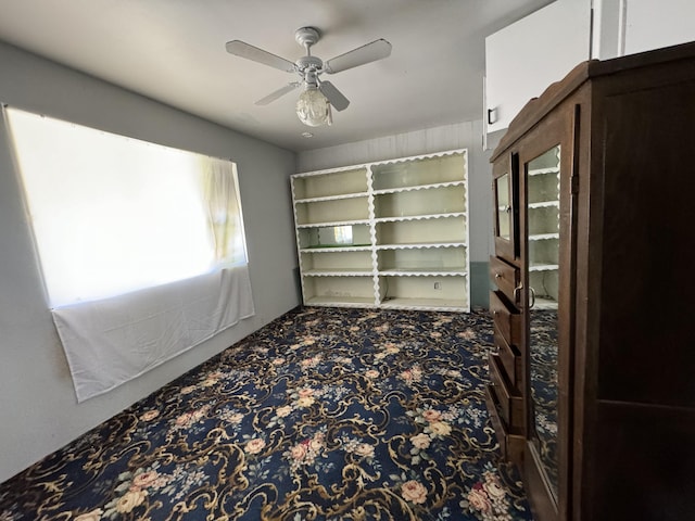 spare room featuring carpet floors and ceiling fan