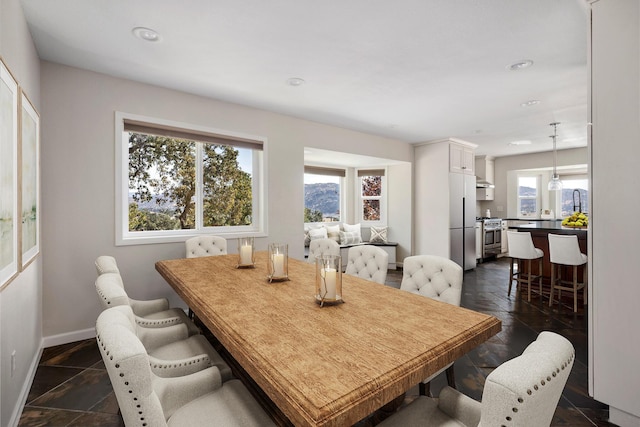 24500 Deertrail Dr, Tehachapi, CA 93561 - dining space with baseboards, recessed lighting, and stone tile flooring