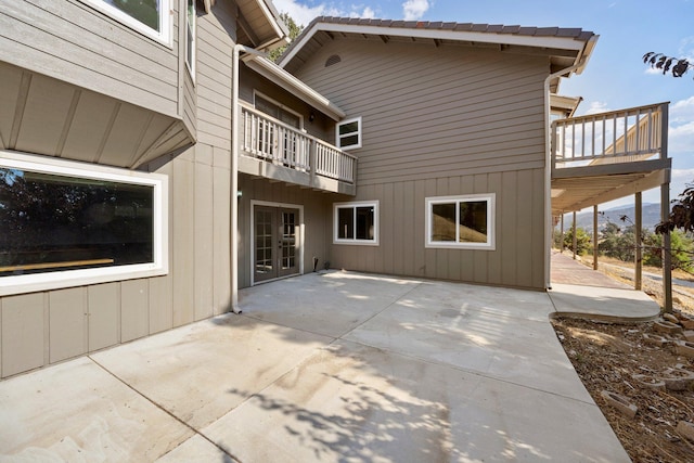 24500 Deertrail Dr, Tehachapi, CA 93561 - rear view of house featuring french doors, a patio, and a balcony