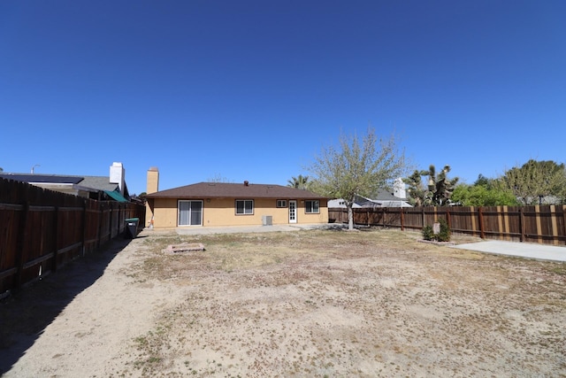 37334 E 55th St, Palmdale, CA 93552 - rear view of property with a fenced backyard and stucco siding
