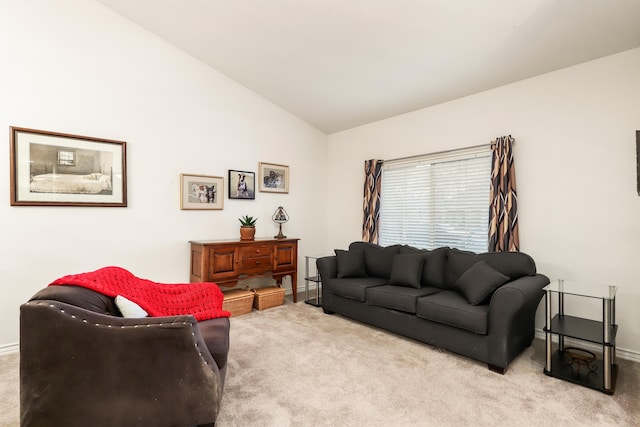 living room with light carpet and vaulted ceiling