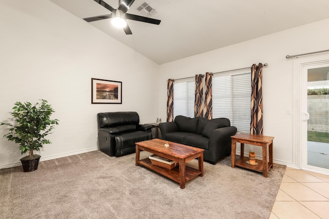 living room featuring a healthy amount of sunlight, light tile patterned floors, ceiling fan, and lofted ceiling