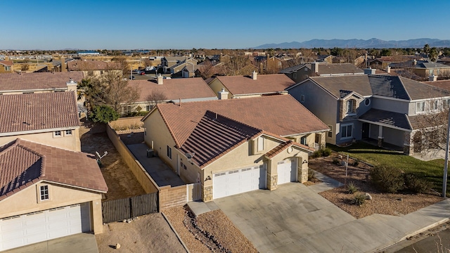 birds eye view of property with a mountain view