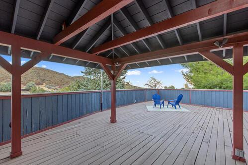 wooden deck featuring a gazebo and a mountain view