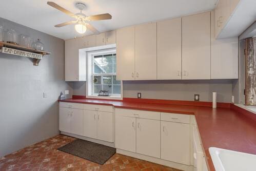 kitchen with cream cabinetry and ceiling fan