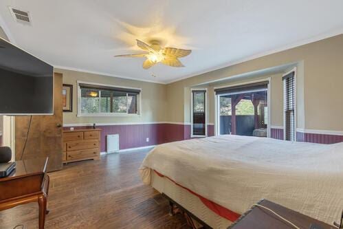 bedroom with crown molding, dark wood-type flooring, access to exterior, and ceiling fan