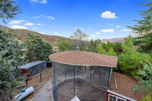 view of patio featuring an outbuilding and a mountain view