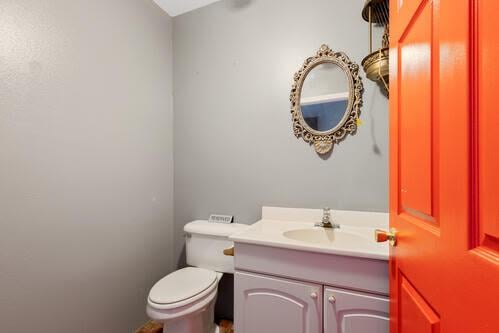 bathroom featuring vanity and toilet