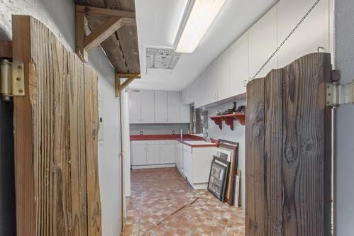 kitchen with sink and white cabinets