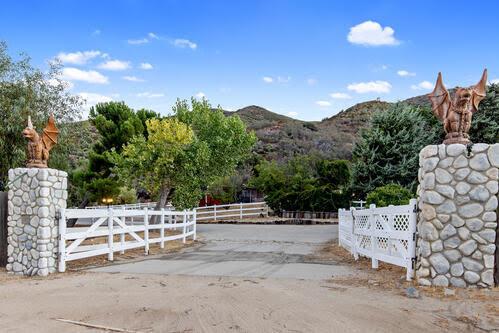 view of gate featuring a mountain view