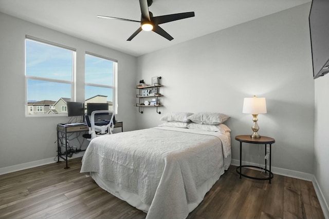 bedroom featuring dark wood-type flooring and ceiling fan