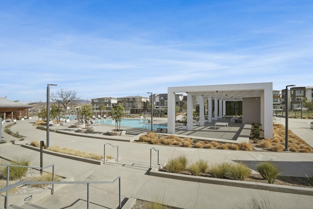 surrounding community with a pool