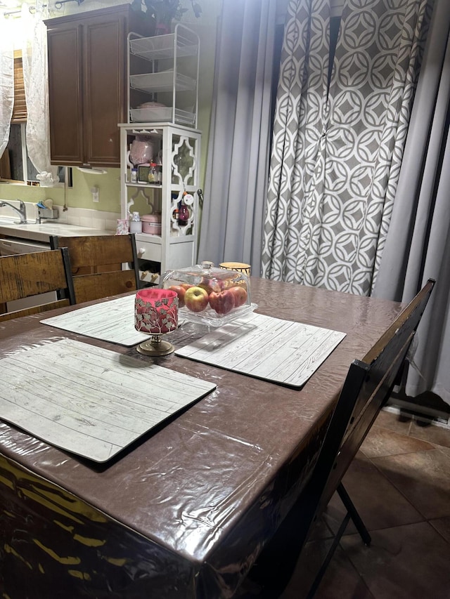 dining space with tile patterned floors