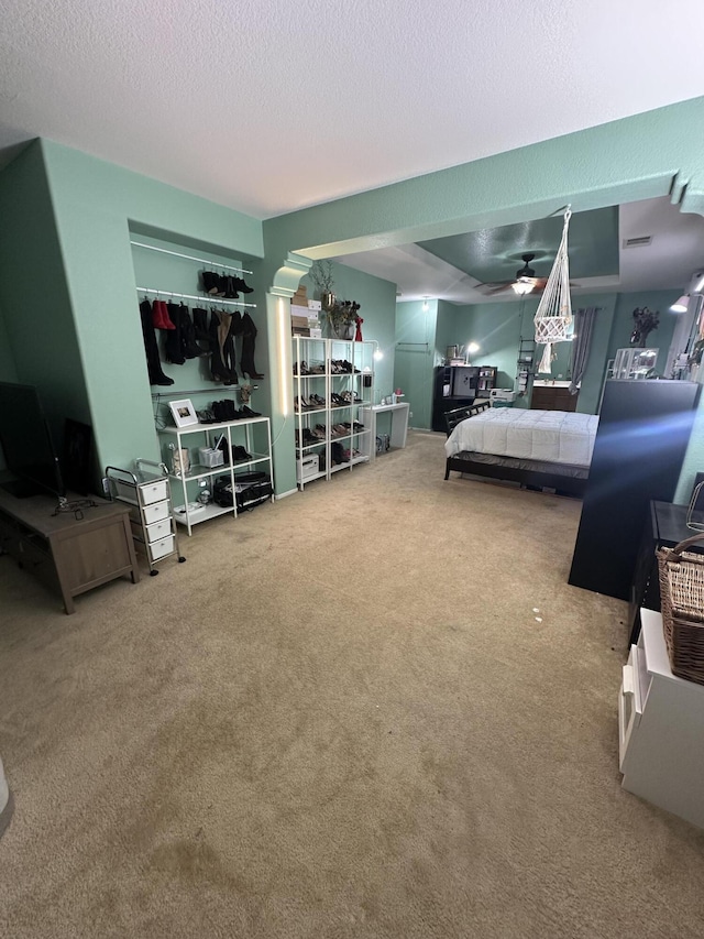 bedroom with carpet and a textured ceiling