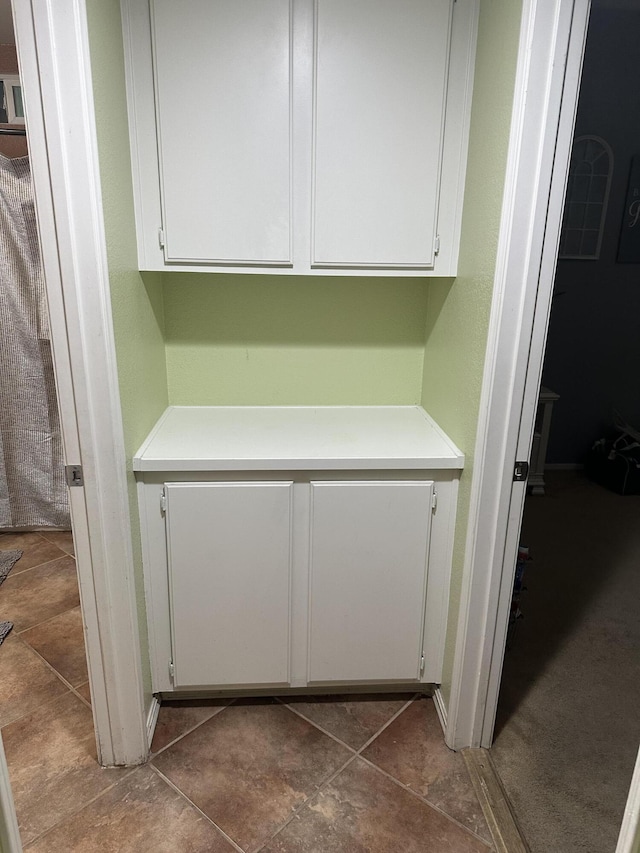 interior space featuring white cabinetry