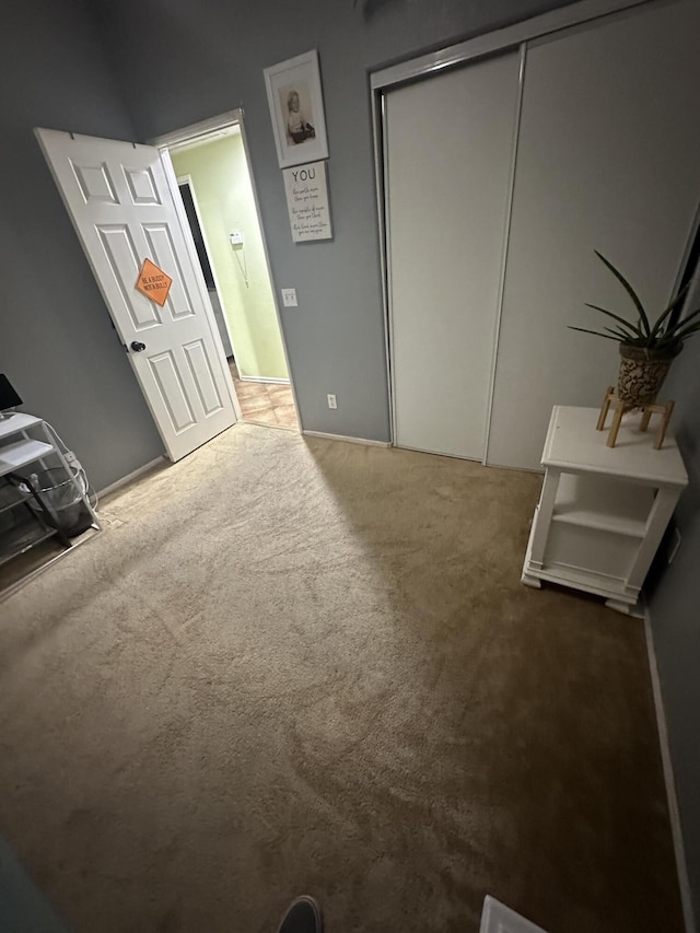 carpeted bedroom featuring a closet