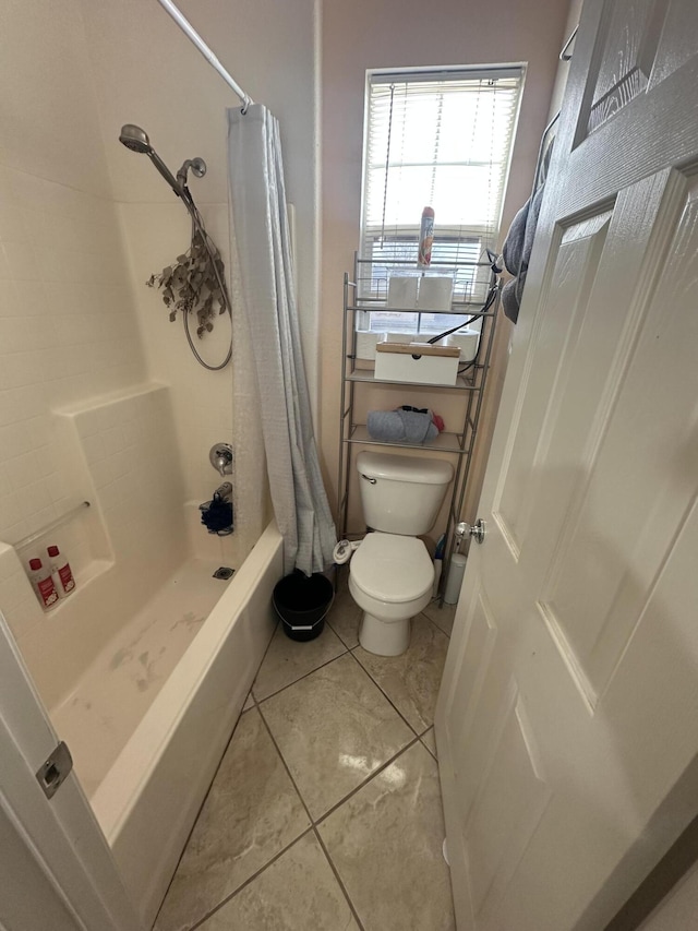 bathroom with tile patterned floors, shower / bath combination with curtain, and toilet