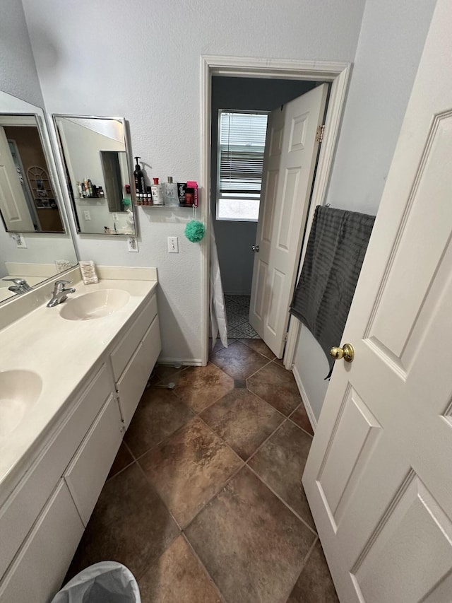 bathroom featuring tile patterned floors and vanity