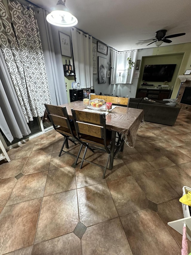 dining space featuring ceiling fan